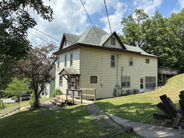 24 Mulberry St, Savanna, IL 61074 - view of property exterior featuring a central AC unit and a shingled roof