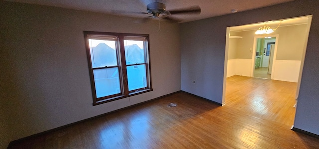 24 Mulberry St, Savanna, IL 61074 - unfurnished room with wood finished floors and ceiling fan