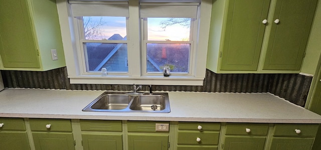 24 Mulberry St, Savanna, IL 61074 - kitchen with green cabinets, plenty of natural light, and light countertops