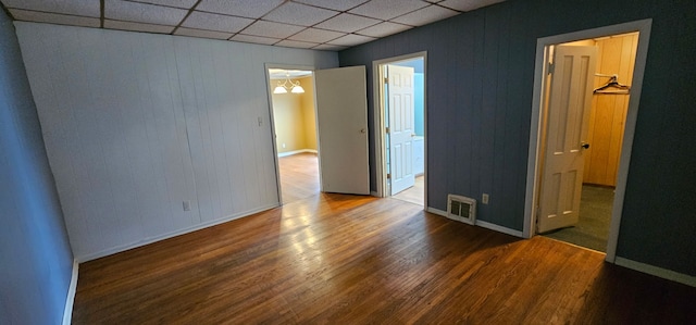 24 Mulberry St, Savanna, IL 61074 - unfurnished bedroom with a paneled ceiling, wood finished floors, and ensuite bath