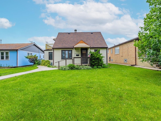 4918 S Luna Ave, Chicago, IL 60638 - view of front of property featuring a front lawn and roof with shingles
