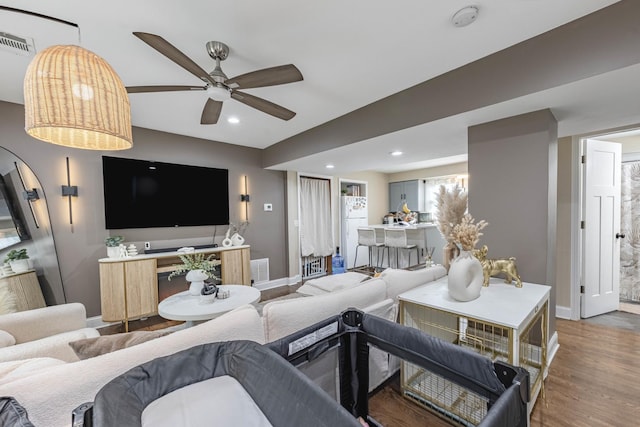 4918 S Luna Ave, Chicago, IL 60638 - living room featuring ceiling fan, wood finished floors, and recessed lighting