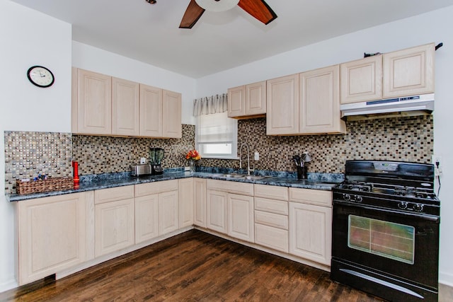 1318 N Menard Ave, Chicago, IL 60651 - kitchen featuring black range with gas stovetop, under cabinet range hood, ceiling fan, dark wood-type flooring, and decorative backsplash