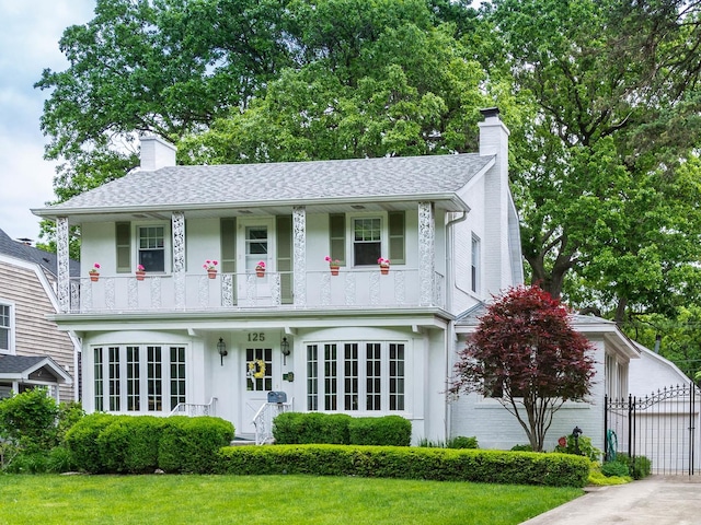 125 Thatcher Ave, River Forest, IL 60305 - view of front of property featuring a chimney, a balcony, a gate, and a garage