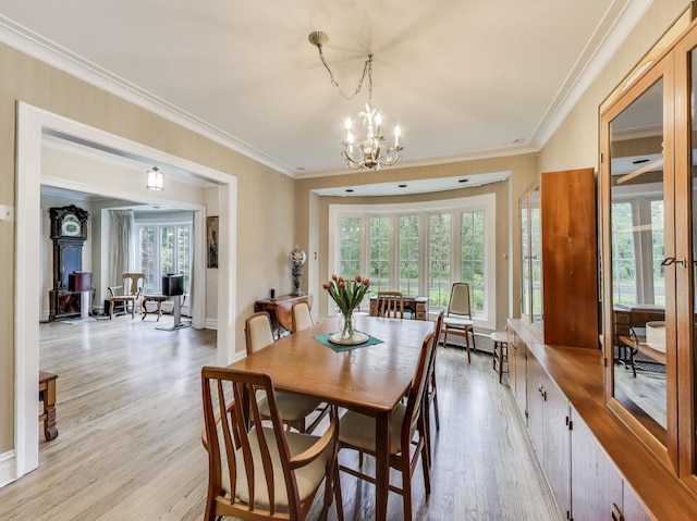 125 Thatcher Ave, River Forest, IL 60305 - dining space with light wood finished floors, a chandelier, healthy amount of natural light, and crown molding