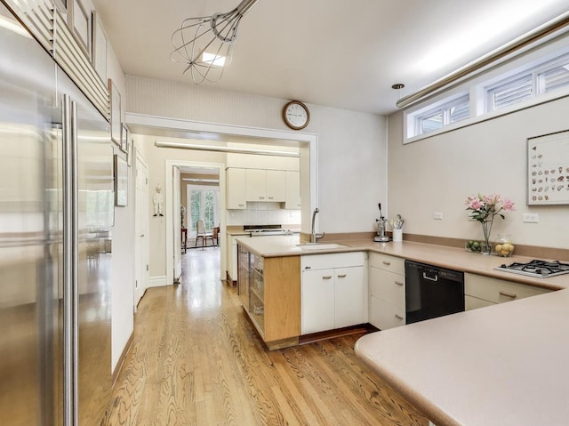 125 Thatcher Ave, River Forest, IL 60305 - kitchen with stainless steel built in refrigerator, black dishwasher, light wood-style flooring, gas stovetop, and white cabinets