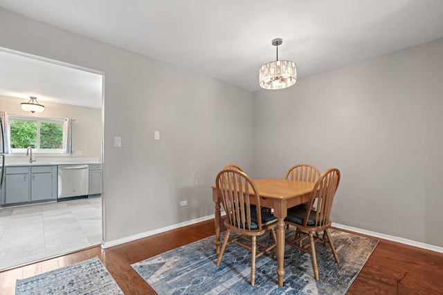 2215 Nichols Rd Unit B, Arlington Heights, IL 60004 - dining space with a chandelier and light wood-style flooring