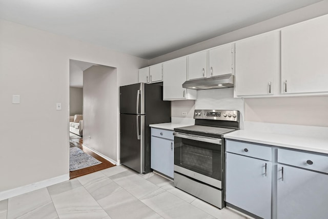 2215 Nichols Rd Unit B, Arlington Heights, IL 60004 - kitchen featuring stainless steel appliances, under cabinet range hood, light countertops, and white cabinetry