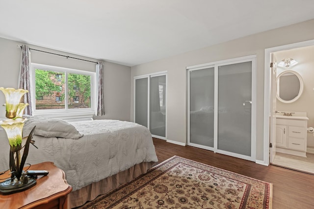 2215 Nichols Rd Unit B, Arlington Heights, IL 60004 - bedroom with two closets, wood finished floors, and ensuite bath