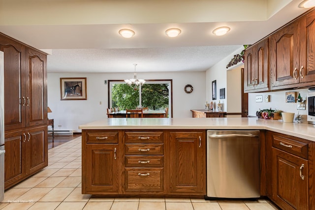 10766 E 7000n Rd, Grant Park, IL 60940 - kitchen featuring a peninsula, light countertops, a baseboard heating unit, a chandelier, and light tile patterned floors