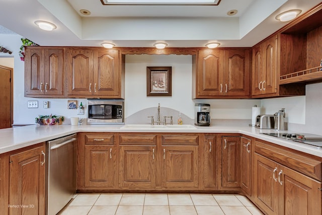 10766 E 7000n Rd, Grant Park, IL 60940 - kitchen with stainless steel appliances, brown cabinetry, light countertops, and light tile patterned floors