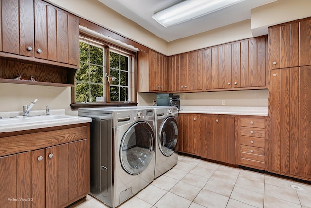 10766 E 7000n Rd, Grant Park, IL 60940 - laundry area featuring cabinet space, washer and dryer, and light tile patterned flooring