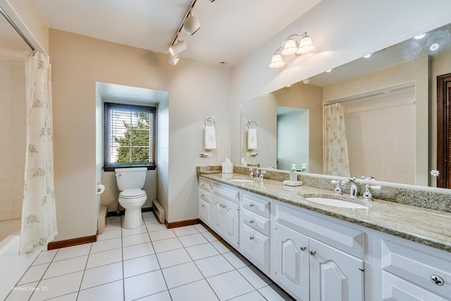 10766 E 7000n Rd, Grant Park, IL 60940 - bathroom with double vanity, track lighting, tile patterned flooring, and shower / bath combo