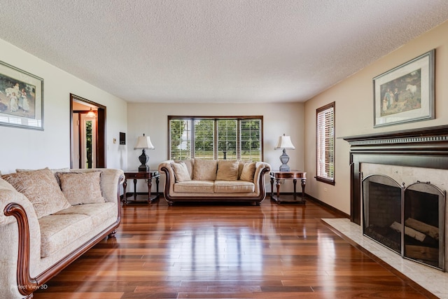 10766 E 7000n Rd, Grant Park, IL 60940 - living room with a fireplace, a textured ceiling, and wood finished floors