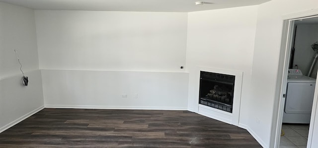 17411 Kedzie Ave, Hazel Crest, IL 60429 - unfurnished living room with washer / clothes dryer, dark wood-style floors, and a fireplace