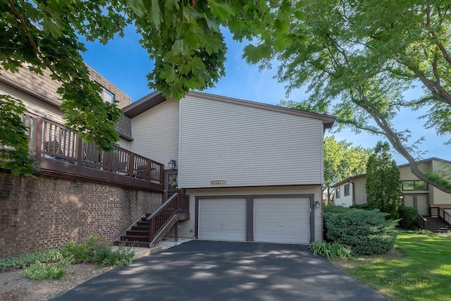 29W400 Thornwood Ln, Warrenville, IL 60555 - view of side of property with an attached garage, driveway, and stairs