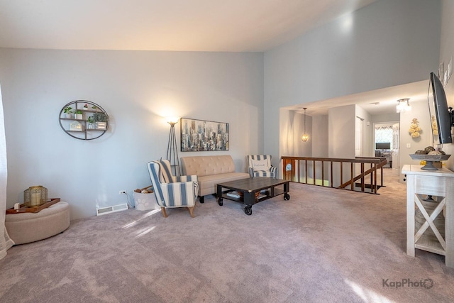 29W400 Thornwood Ln, Warrenville, IL 60555 - living area with an upstairs landing, carpet floors, and a towering ceiling