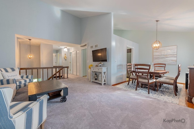 29W400 Thornwood Ln, Warrenville, IL 60555 - living area with carpet floors, a chandelier, and high vaulted ceiling