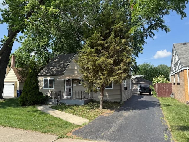 116 S Harold Ave, Northlake, IL 60164 - view of front of home featuring a detached garage and an outdoor structure