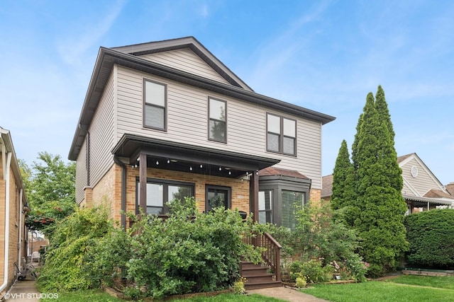 3109 N Oketo Ave, Chicago, IL 60707 - view of front of home featuring brick siding, covered porch, and a front yard