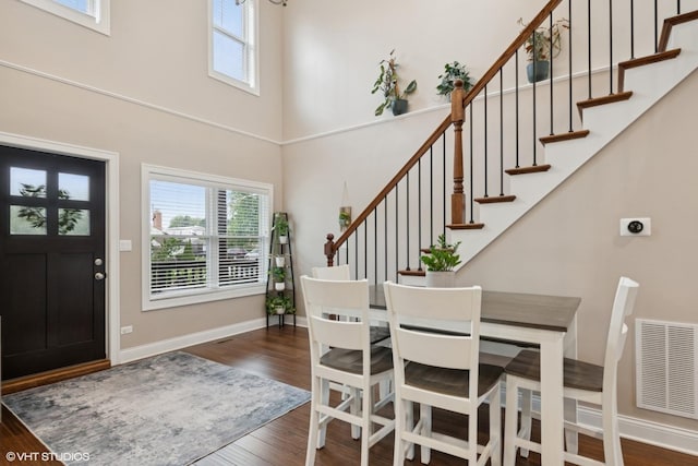 3109 N Oketo Ave, Chicago, IL 60707 - entryway featuring a towering ceiling, healthy amount of natural light, wood finished floors, and stairway