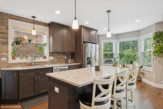 3109 N Oketo Ave, Chicago, IL 60707 - kitchen with appliances with stainless steel finishes, dark brown cabinetry, healthy amount of natural light, and recessed lighting
