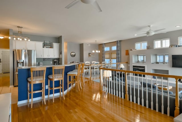 930 Candlewick Dr NE, Poplar Grove, IL 61065 - kitchen featuring ceiling fan, stainless steel refrigerator with ice dispenser, light wood-type flooring, white cabinets, and recessed lighting