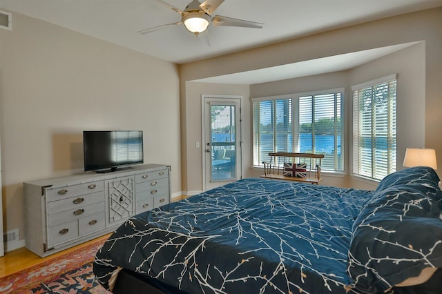 930 Candlewick Dr NE, Poplar Grove, IL 61065 - bedroom with multiple windows, access to exterior, and light wood-style floors