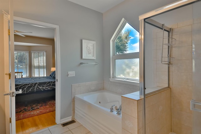 930 Candlewick Dr NE, Poplar Grove, IL 61065 - full bath featuring connected bathroom, a tub with jets, a shower stall, and plenty of natural light