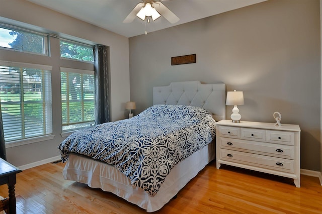 930 Candlewick Dr NE, Poplar Grove, IL 61065 - bedroom with light wood-style flooring and a ceiling fan