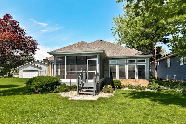 930 Candlewick Dr NE, Poplar Grove, IL 61065 - rear view of house featuring a sunroom, a yard, roof with shingles, a garage, and brick siding