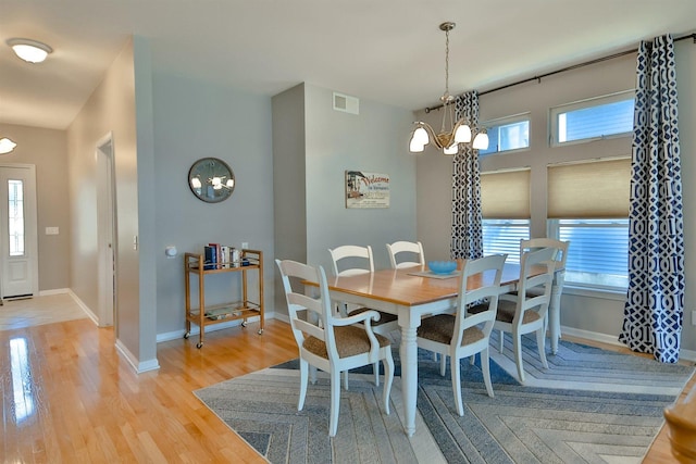 930 Candlewick Dr NE, Poplar Grove, IL 61065 - dining room with a chandelier and light wood-type flooring