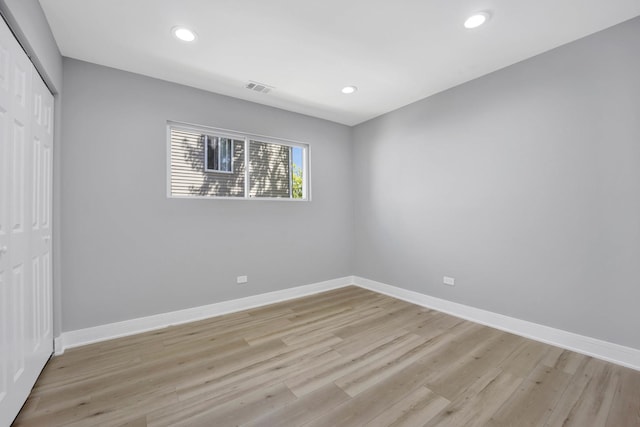 27W180 Cooley Ave, Winfield, IL 60190 - unfurnished bedroom featuring a closet, light wood-style flooring, and recessed lighting