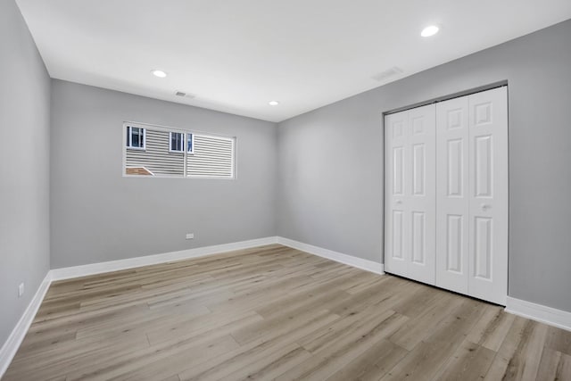 27W180 Cooley Ave, Winfield, IL 60190 - unfurnished bedroom with light wood-style floors, a closet, and recessed lighting