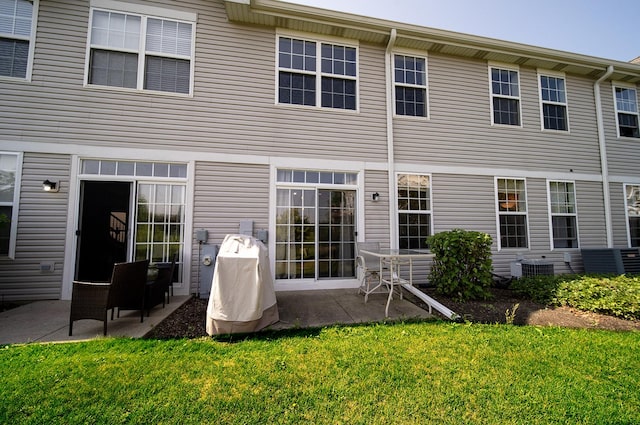 610 N Red Deer Rd, Round Lake, IL 60073 - rear view of house with a patio area and a lawn