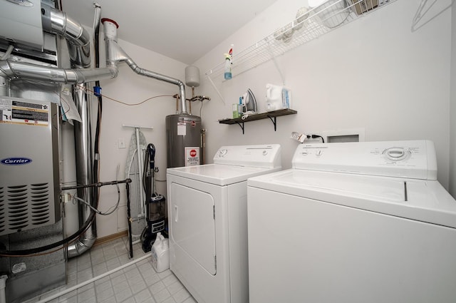 610 N Red Deer Rd, Round Lake, IL 60073 - laundry area featuring washing machine and clothes dryer, light tile patterned floors, and water heater
