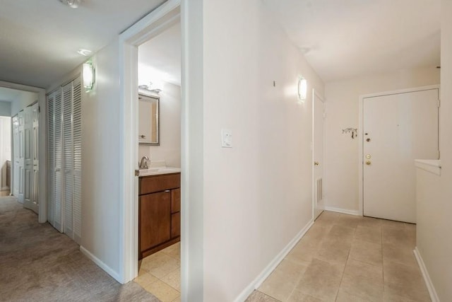 1738 Chicago Ave Unit 303, Evanston, IL 60201 - hallway featuring baseboards and a sink