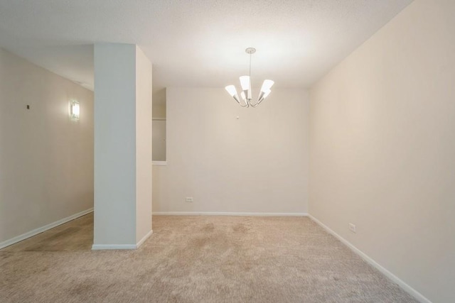 1738 Chicago Ave Unit 303, Evanston, IL 60201 - spare room featuring carpet and a chandelier