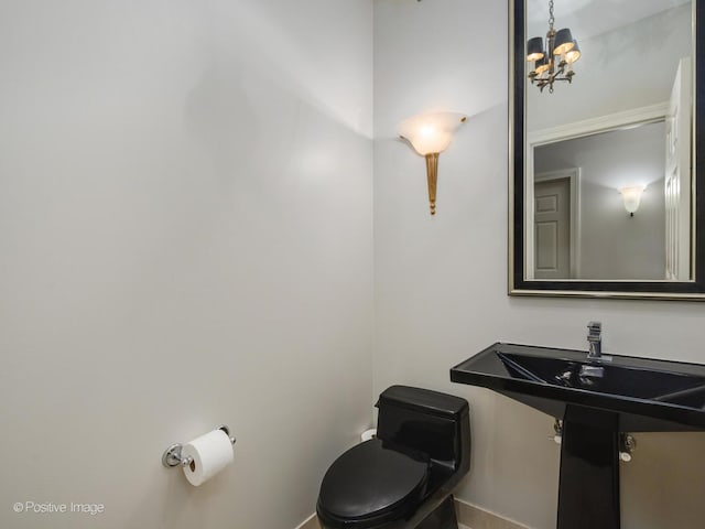 21 E Huron St Unit 1106, Chicago, IL 60611 - half bath featuring toilet and a chandelier