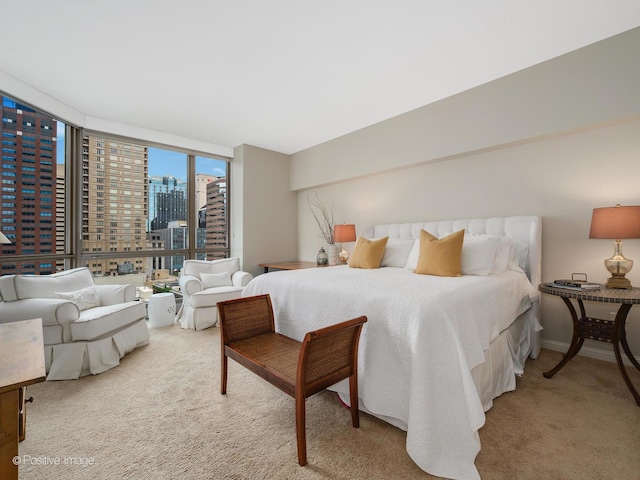 21 E Huron St Unit 1106, Chicago, IL 60611 - bedroom featuring a view of skyline, carpet floors, and expansive windows