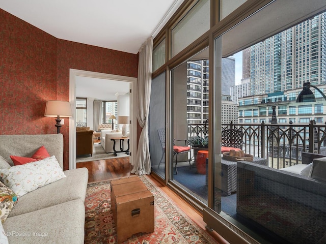 21 E Huron St Unit 1106, Chicago, IL 60611 - living room with wood finished floors, wallpapered walls, and a city view