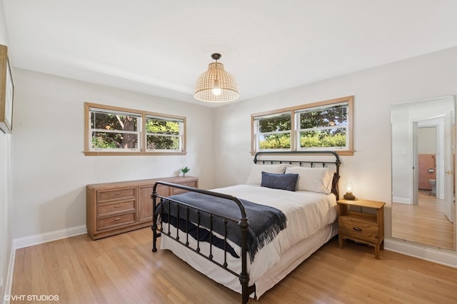 1 E Milburn Ave, Mount Prospect, IL 60056 - bedroom with light wood-type flooring and baseboards