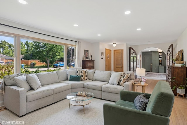 1 E Milburn Ave, Mount Prospect, IL 60056 - living room with arched walkways, light wood finished floors, and recessed lighting