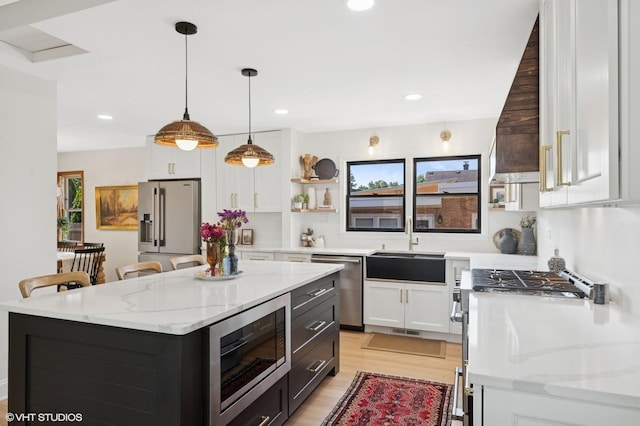1 E Milburn Ave, Mount Prospect, IL 60056 - kitchen featuring stainless steel appliances, white cabinets, light wood finished floors, open shelves, and hanging light fixtures