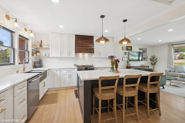 1 E Milburn Ave, Mount Prospect, IL 60056 - kitchen featuring custom range hood, appliances with stainless steel finishes, a kitchen island, light wood-type flooring, and open shelves