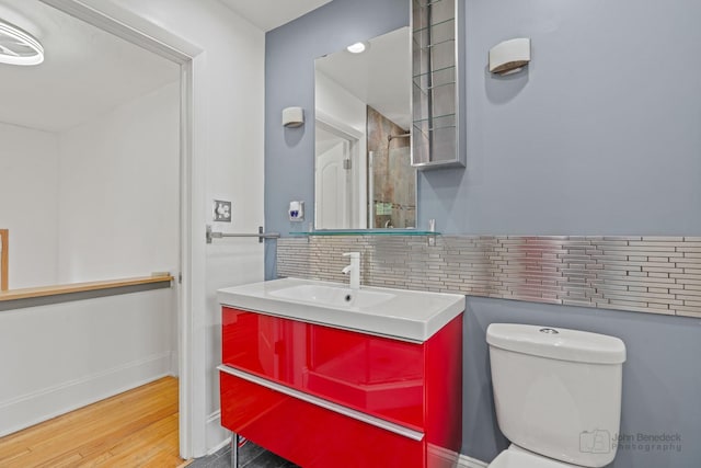 619 N 4th Ave, Maywood, IL 60153 - bathroom featuring vanity, wood finished floors, and tasteful backsplash