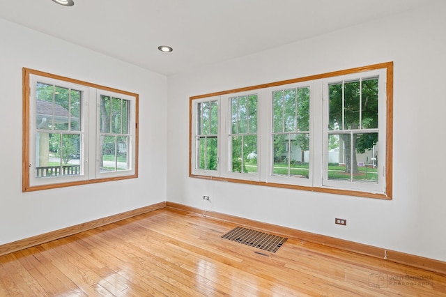 619 N 4th Ave, Maywood, IL 60153 - unfurnished room featuring plenty of natural light, light wood-style flooring, and recessed lighting