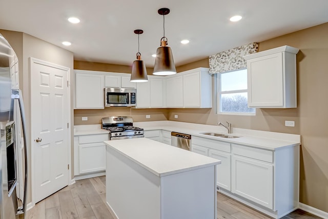 458 Bower Ln, Oswego, IL 60543 - kitchen with stainless steel appliances, light wood-type flooring, white cabinetry, and recessed lighting