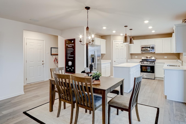 458 Bower Ln, Oswego, IL 60543 - dining area featuring light wood-style flooring, recessed lighting, and a chandelier