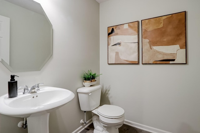 458 Bower Ln, Oswego, IL 60543 - half bathroom with toilet and wood finished floors